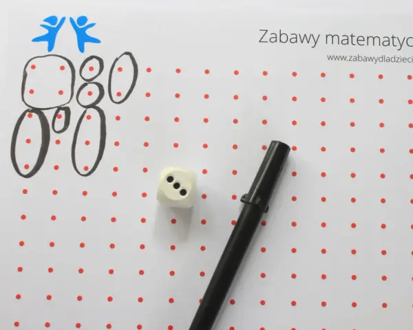 Zabawy matematyczne dla 6 latka: rysowanie cyfr i figur z kropek, kostka do gry i flamaster.