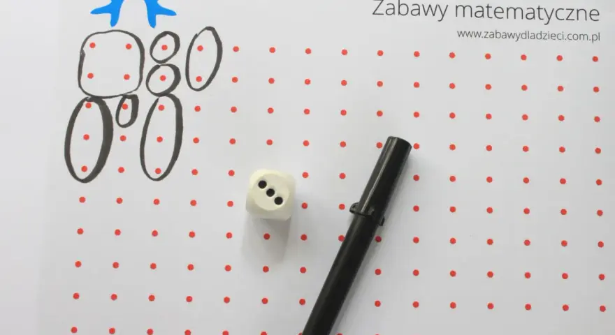 Zabawy matematyczne dla 6 latka: rysowanie cyfr i figur z kropek, kostka do gry i flamaster.